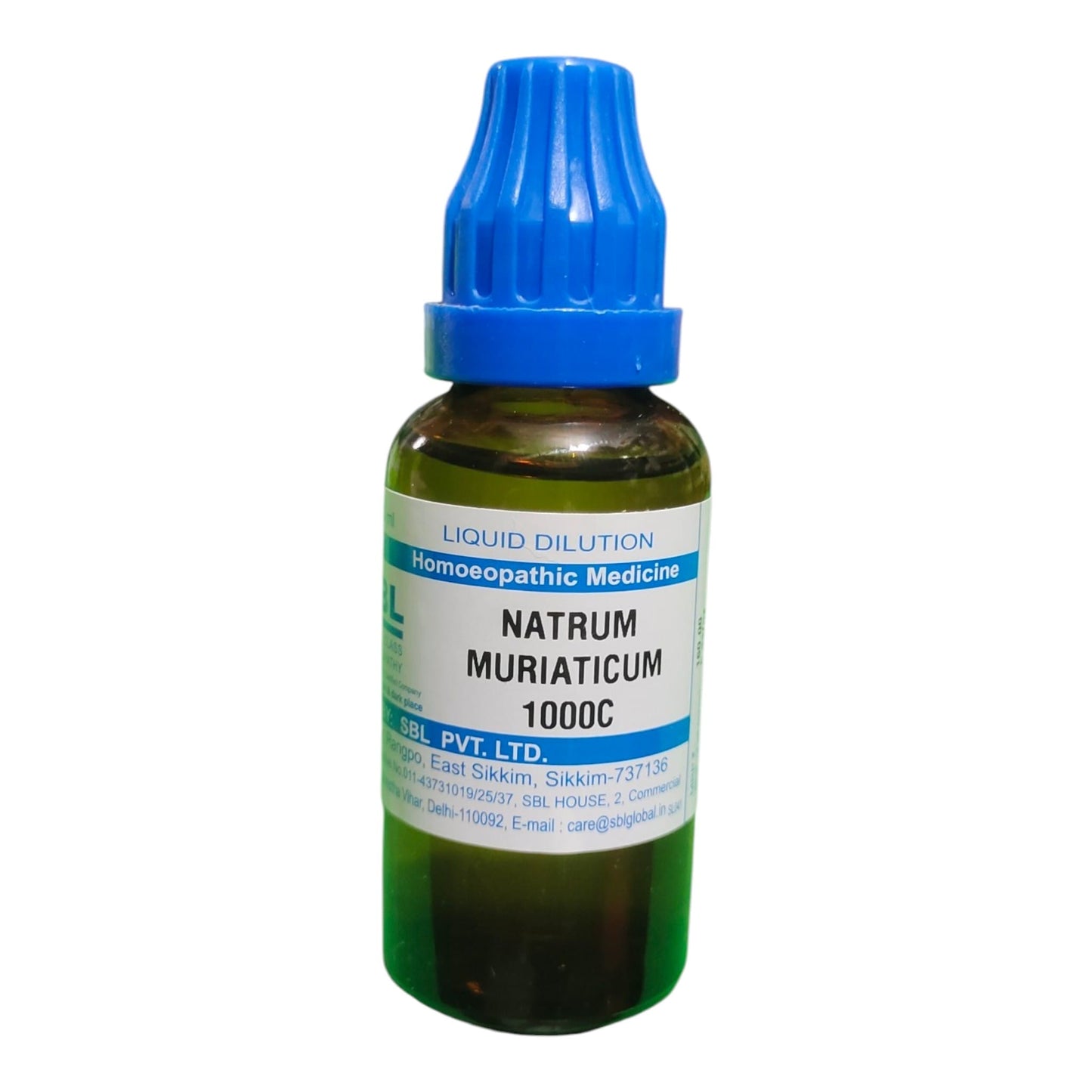 A small amber glass dropper bottle of Natrum Muriaticum 1000C homeopathic medicine with a blue cap and white label, isolated on a white background.