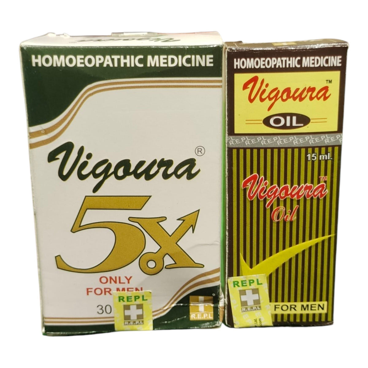 Two boxes of Vigoura 5x Homoeopathic Medicine for men, one larger 30 ml box and one smaller 15 ml oil bottle, shown on a plain white background.