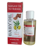 A bottle of SIMILIA natural oil for babies with its packaging box. The bottle is transparent showing the yellowish oil inside, and the packaging has images of nuts and a leaf, indicating natural ingredients.