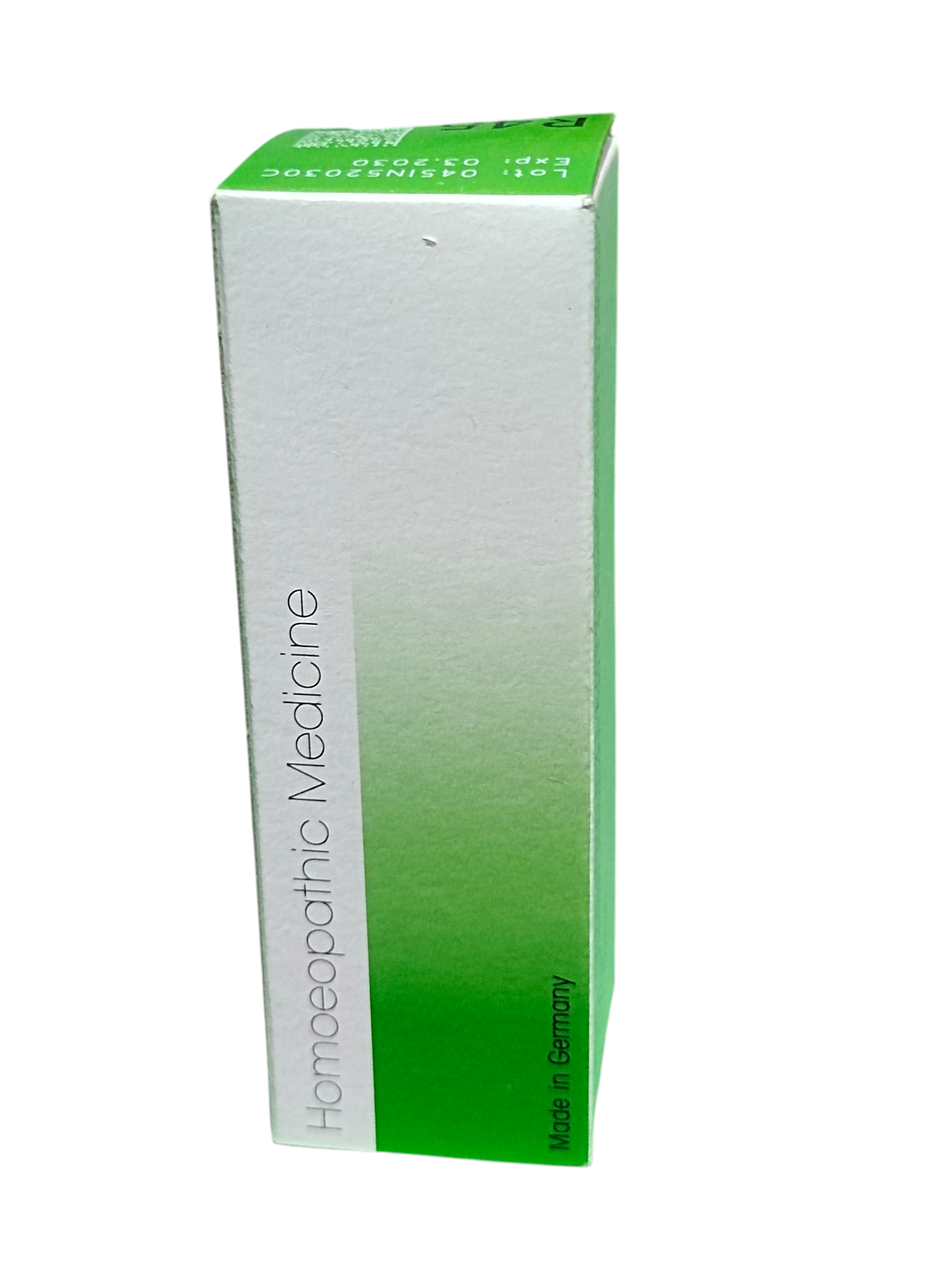 Box of homeopathic medicine with green and white design on a white background
