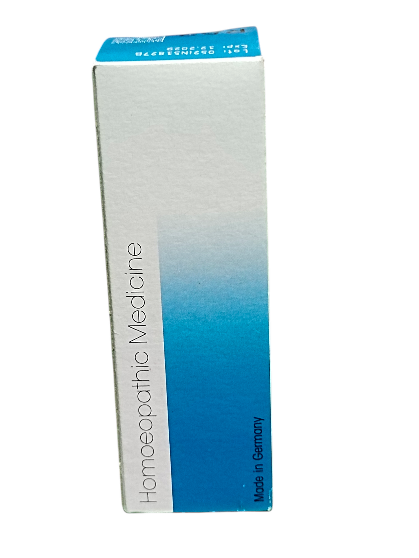 Box of homeopathic medicine with blue and white design on a white background