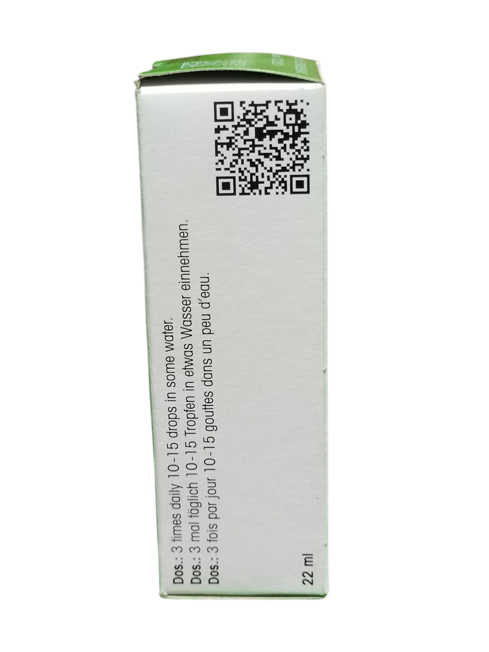 Back of a green and white container with text and a QR code on a white background