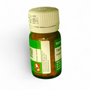 Small green bottle with a white cap on a white background