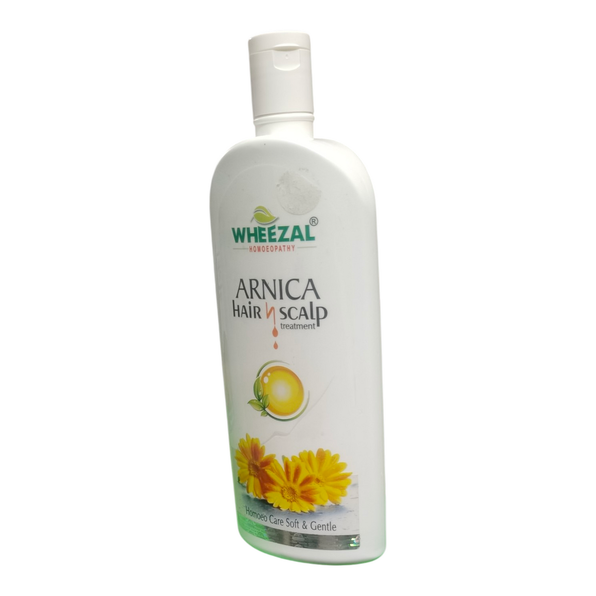 Wheezal Arnica Hair & Scalp Treatment bottle on a white background