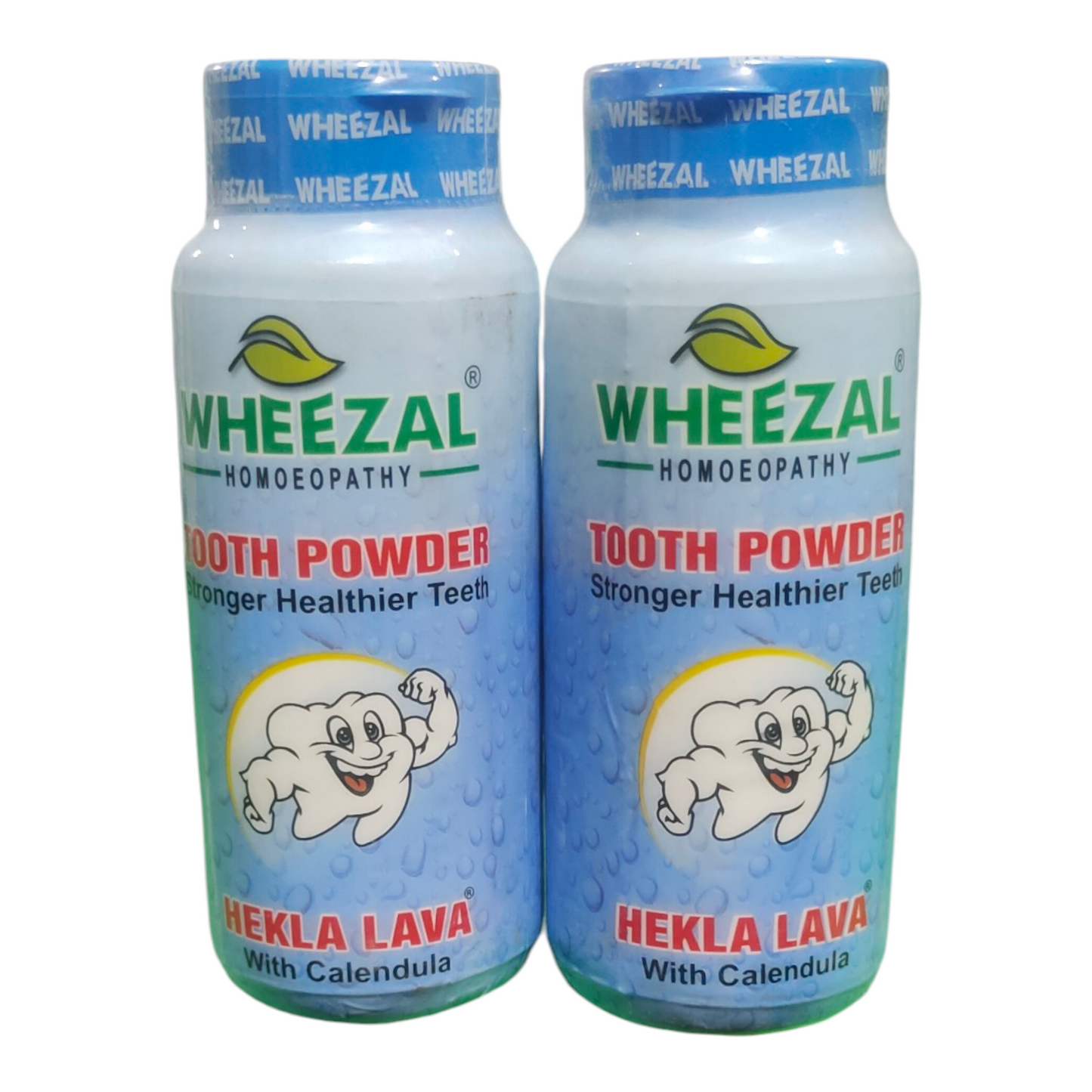 Two bottles of Wheezal tooth powder on a white background