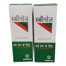 Two boxes of Skinoal with green and white design on a white background