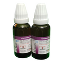 Two bottles of B.P Drops with white caps on a white background