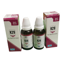 Two bottles and their boxes of K29 drops for warts and corn on a white background