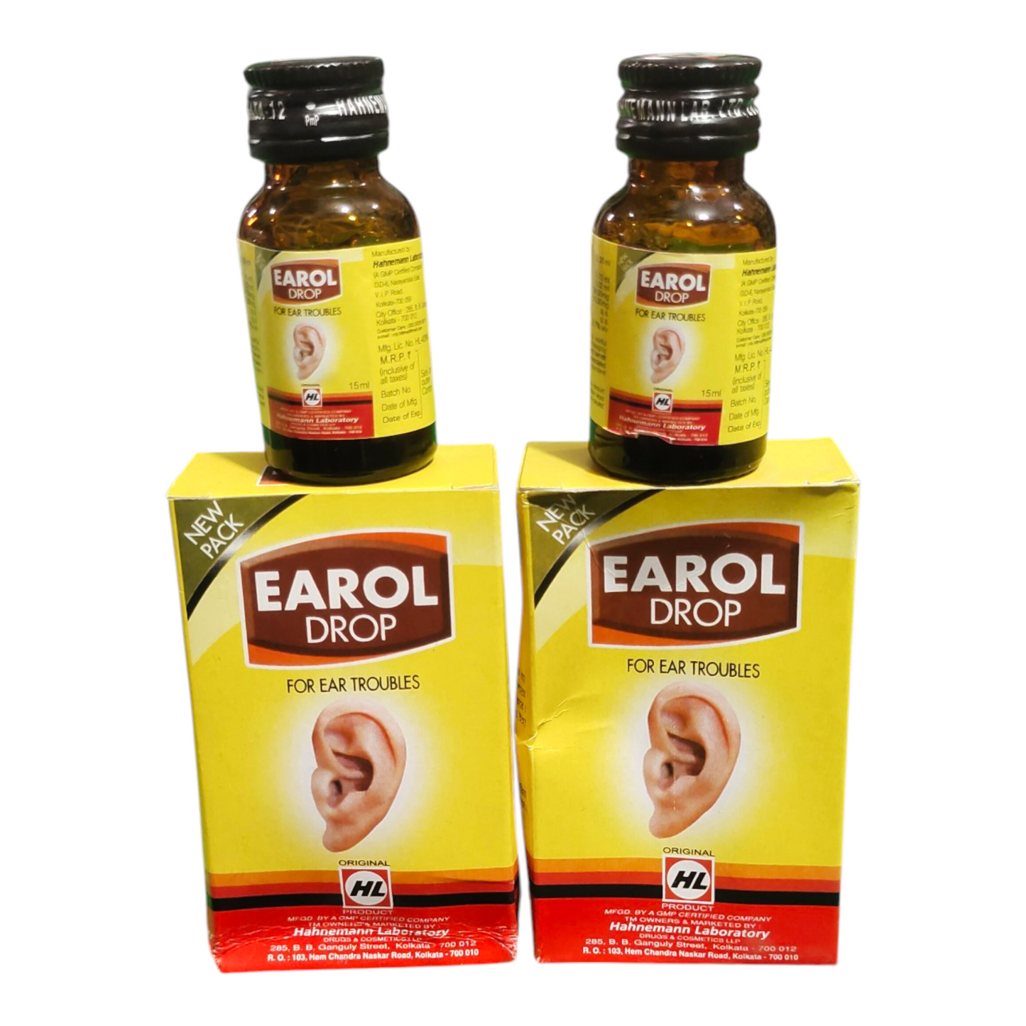 Two bottles and their boxes of Earol Drop for ear troubles on a white background