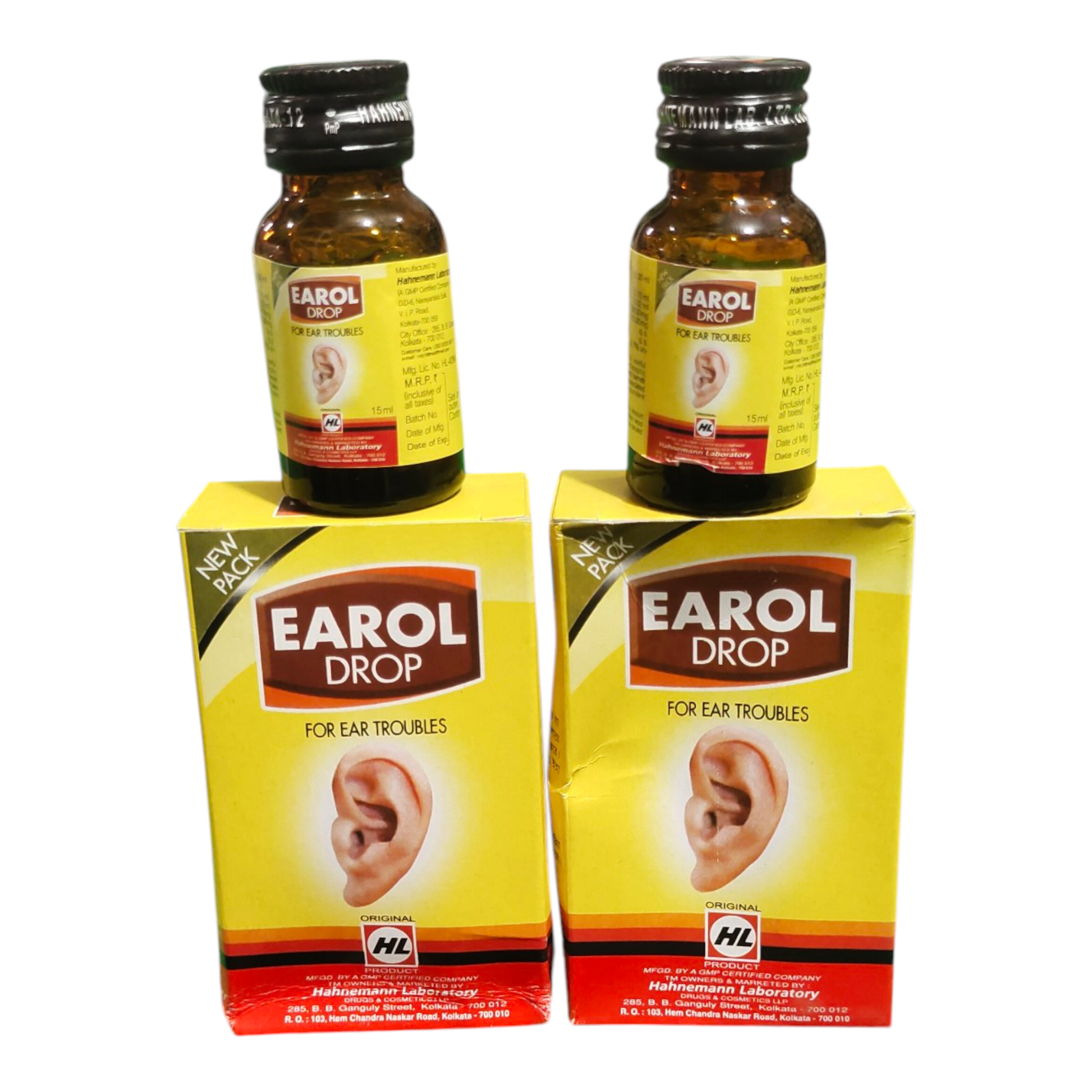 Two bottles and their boxes of Earol Drop for ear troubles on a white background