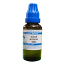 Bottle of Acidum Nitricum 1000C with blue cap on a white background