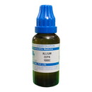 Bottle of Allium Cepa liquid dilution with blue cap on a white background