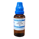 Bottle of Acidum Carbolicum 30C with blue cap on a white background