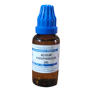 Homeopathic medicine bottle with blue cap and label on a white background