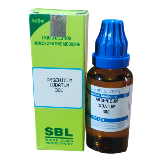 Homeopathic medicine bottle and packaging with SBL branding on a white background