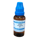Homeopathic medicine bottle with blue cap on a white background