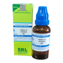 Homeopathic medicine bottle with blue cap and label next to its packaging on a white background