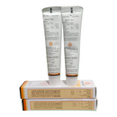 Two tubes of cream with their packaging on a white background