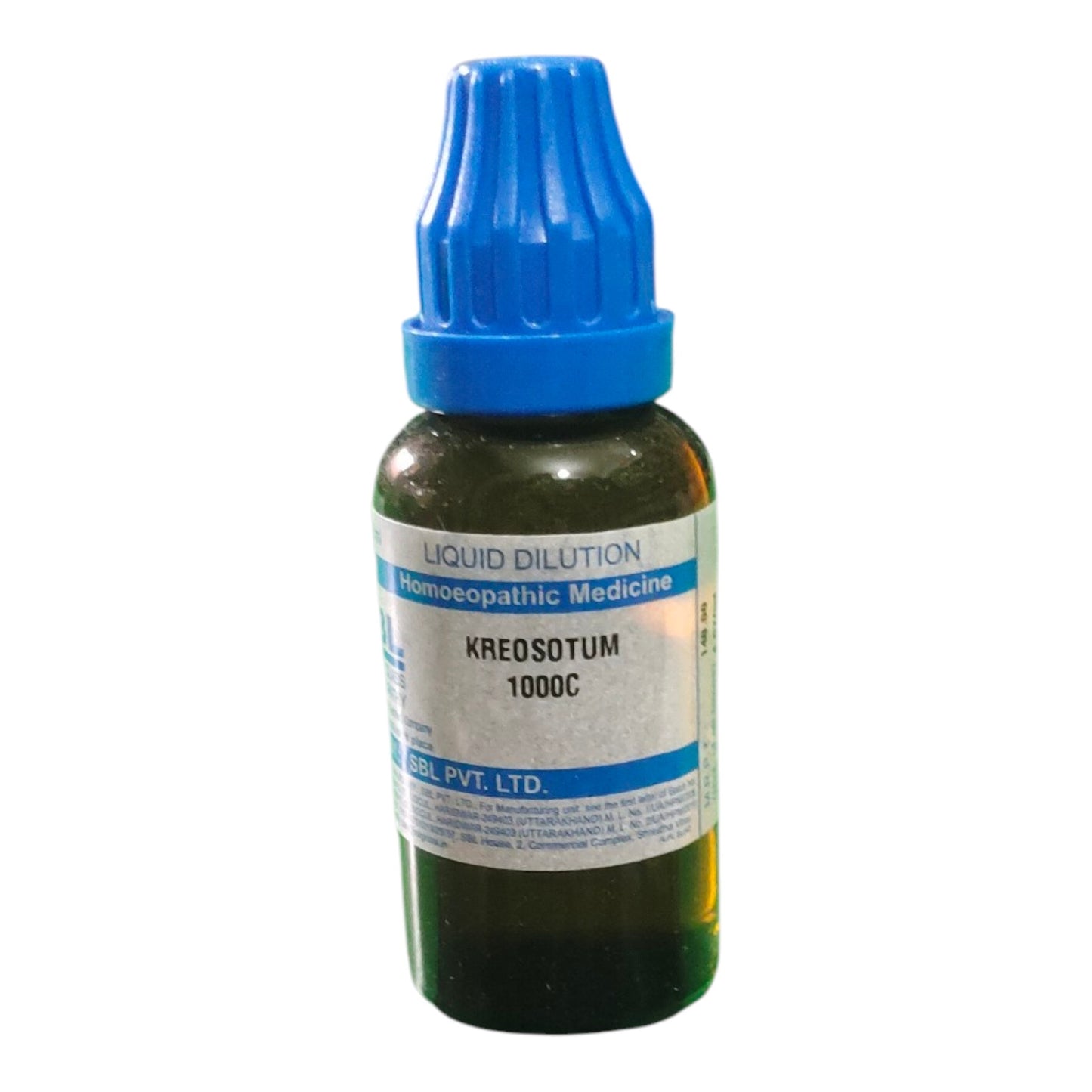 Bottle of KREOSOTUM 1000C liquid dilution with blue cap on a white background