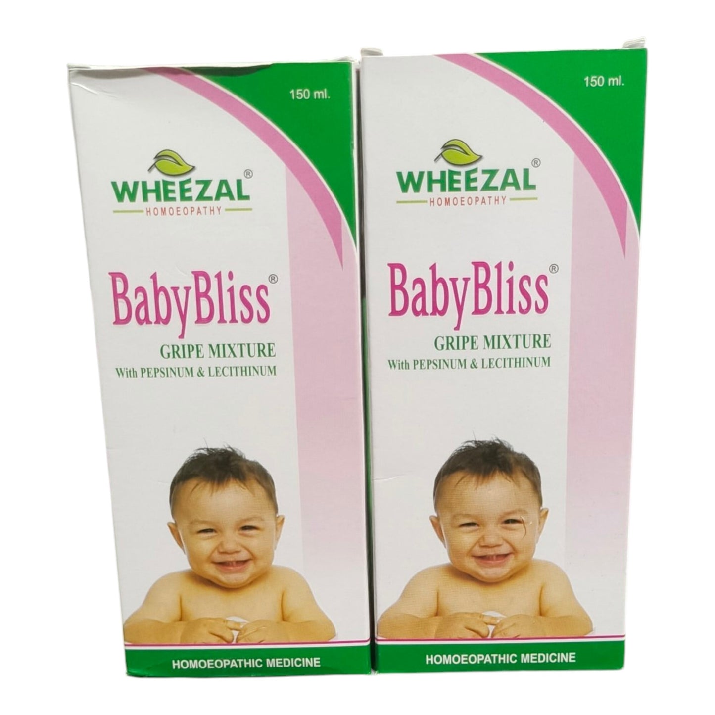 Two boxes of Wheezal BabyBliss Gripe Mixture (150 ml) shown side-by-side on a white background. The packaging features a white background with pink and green curved accents, the Wheezal logo, and a photo of a smiling baby.