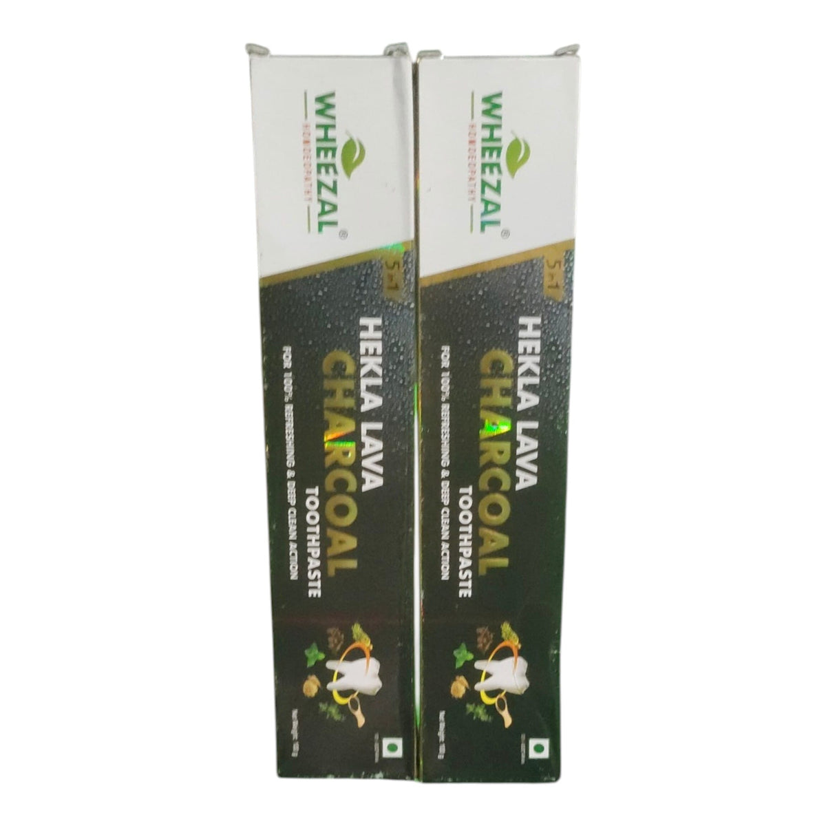 Two boxes of Wheezal Hekla Lava Charcoal Toothpaste standing upright against a plain white background.
