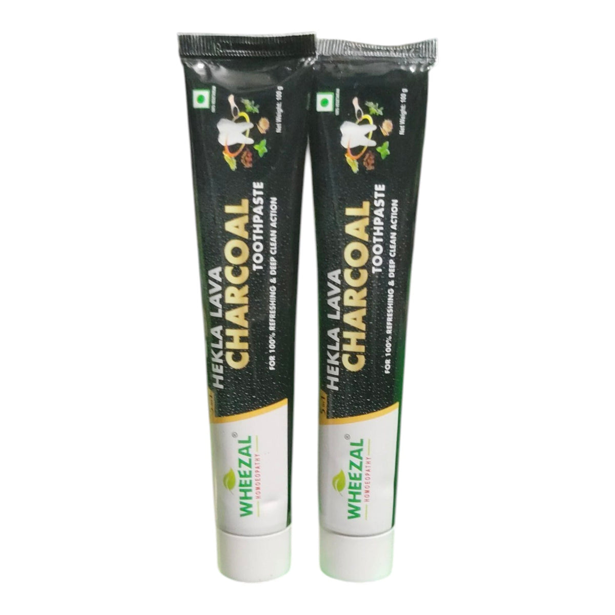 Two squeeze tubes of Wheezal Fieka Lava Charcoal Toothpaste standing upright against a plain white background.