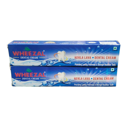 Two blue boxes of Wheezal Hekla Lava Dental Cream stacked vertically on a plain white background.