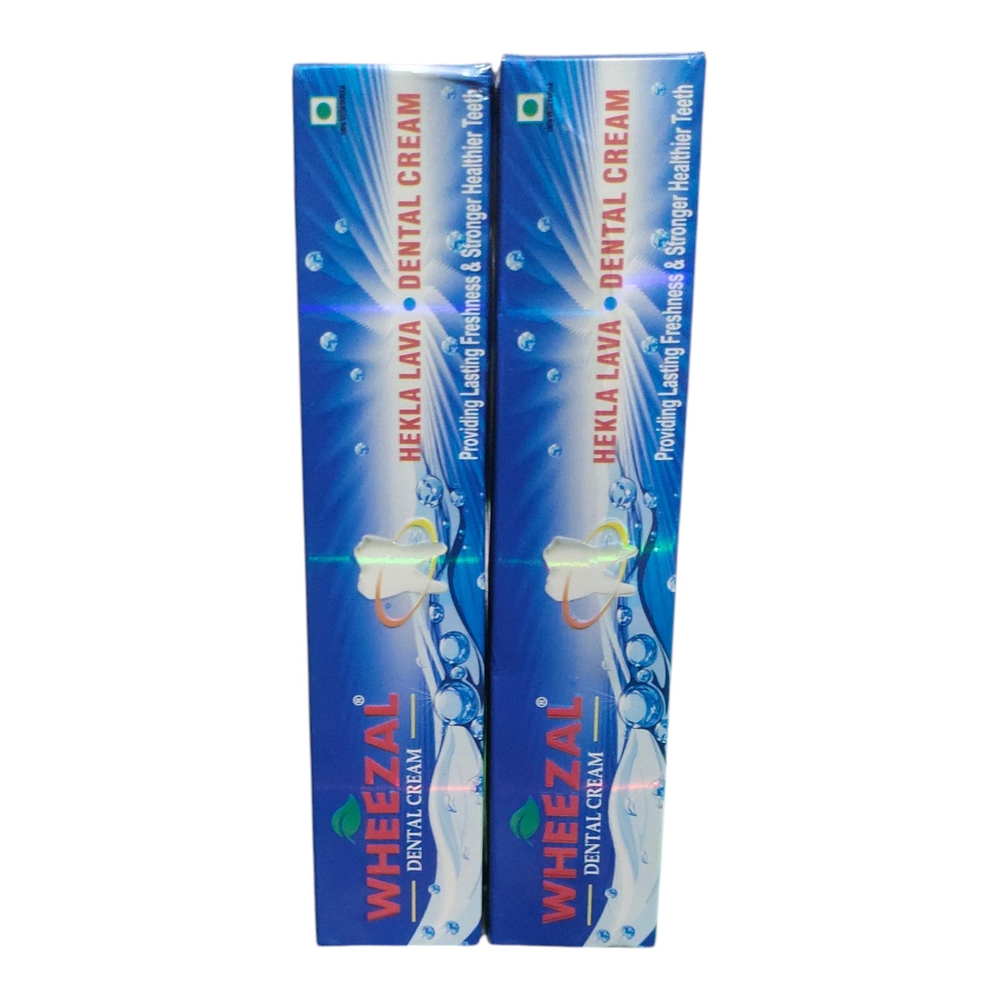 Two blue boxes of Wheezal Hekla Lava Dental Cream standing upright against a plain white background.