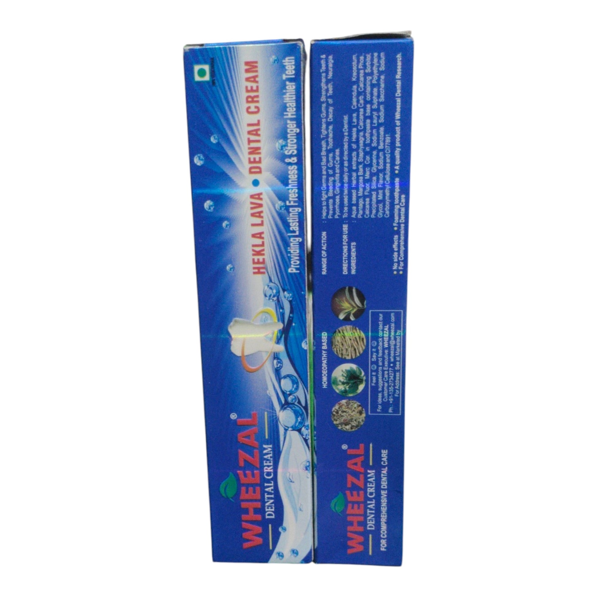 Two blue boxes of Wheezal Herbal Lava Dental Cream shown side by side on a plain white background.