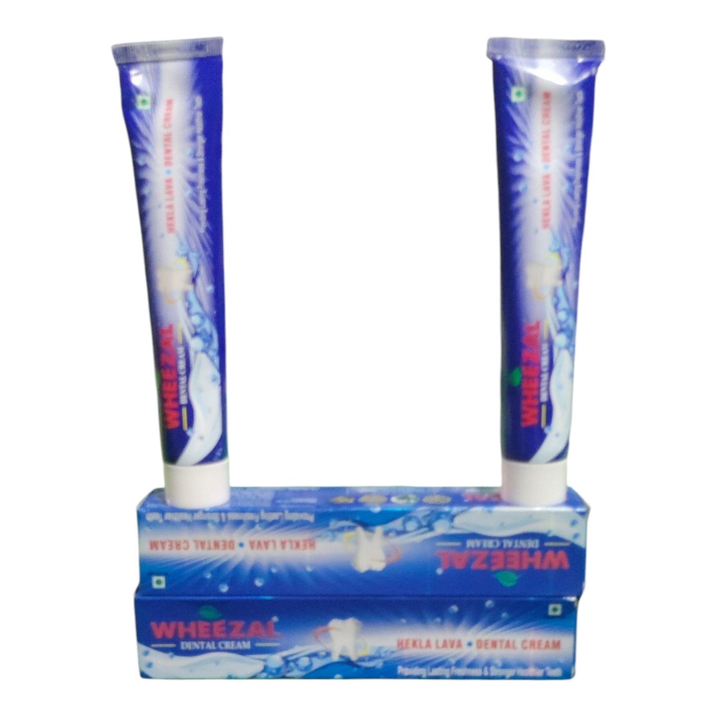 Two blue and white tubes of Wheeza1 Gelta Lava + Dental Cream standing upright on top of their blue retail box against a plain white background.