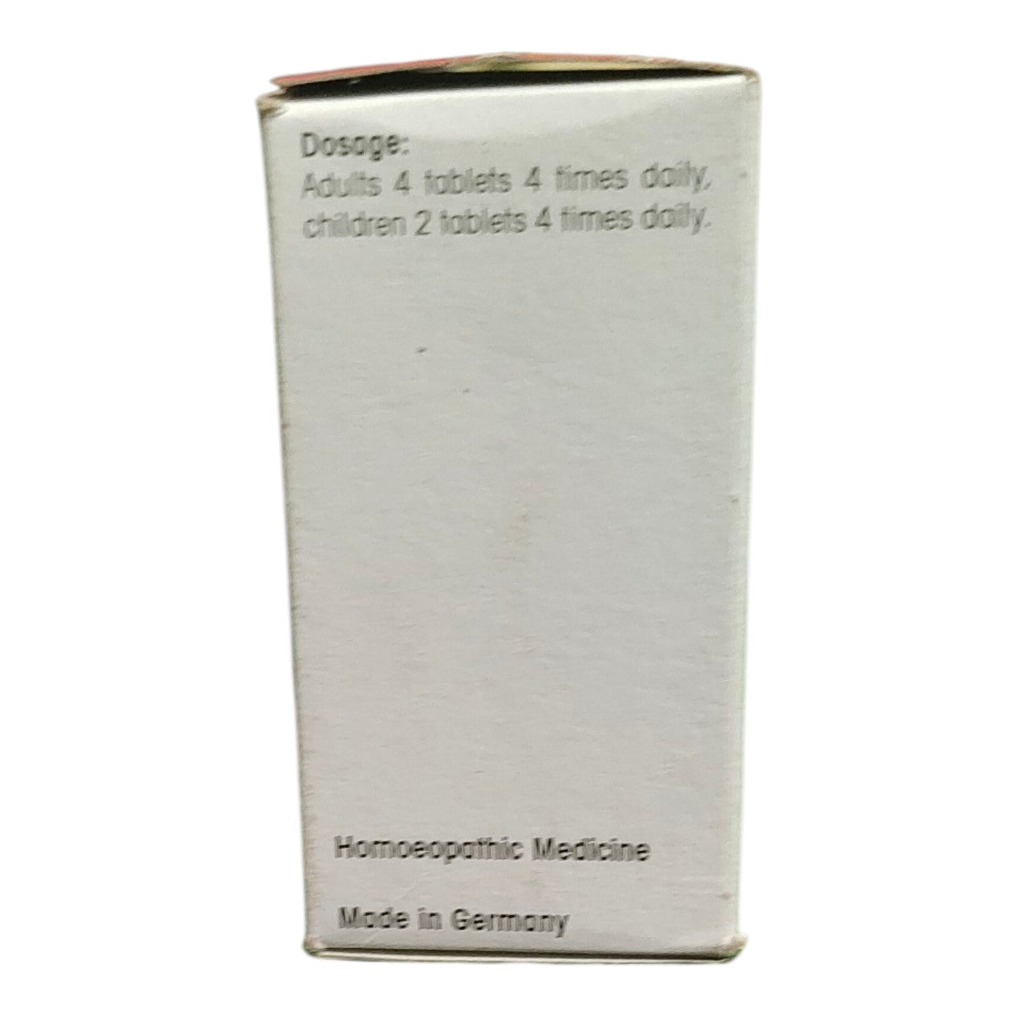 A white cardboard box for homeopathic medicine, showing the dosage instructions and 'Made in Germany' text on a plain white background.