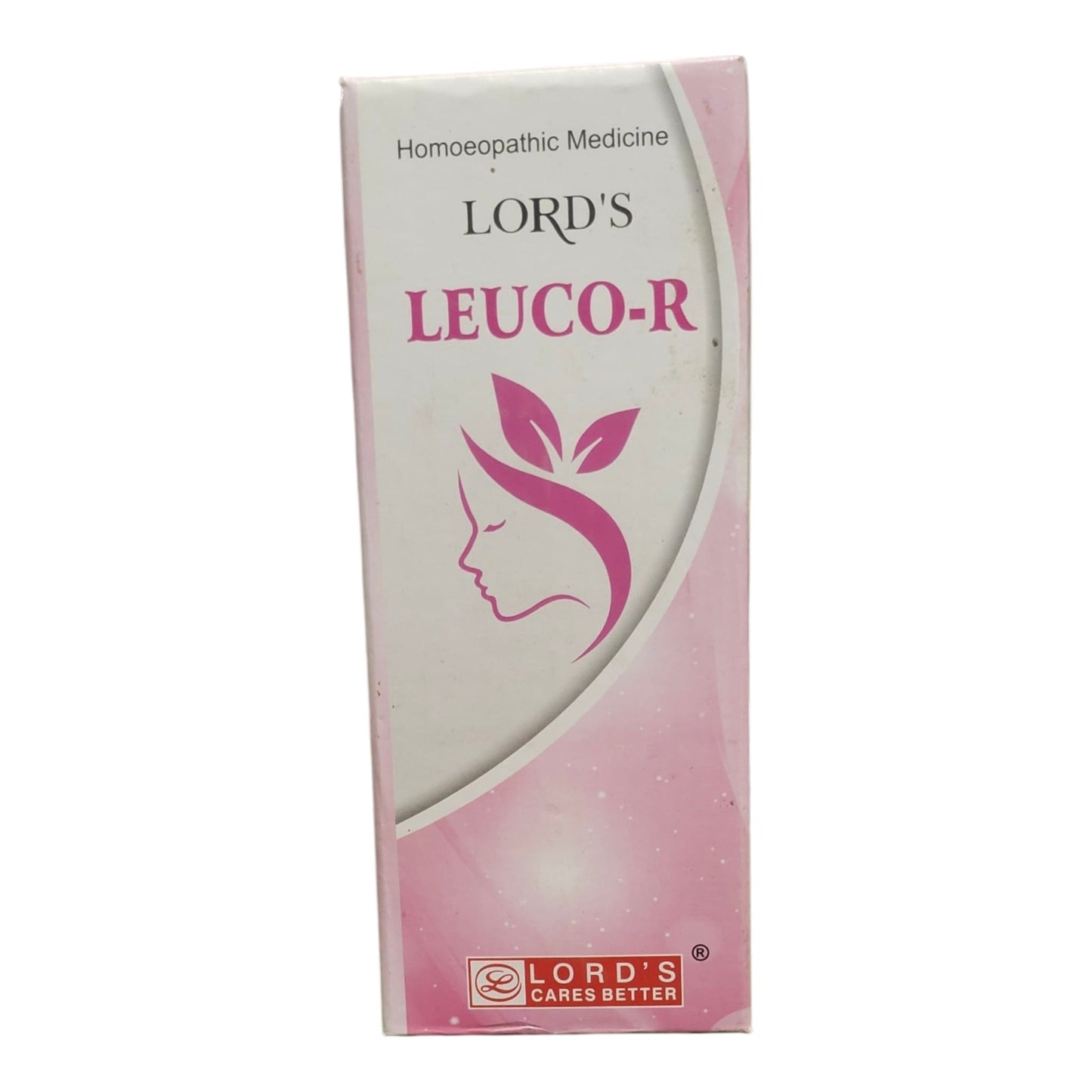 A box of Lord's Leuco-R homeopathic medicine, featuring a white and pink design with a stylized female profile and leaves.