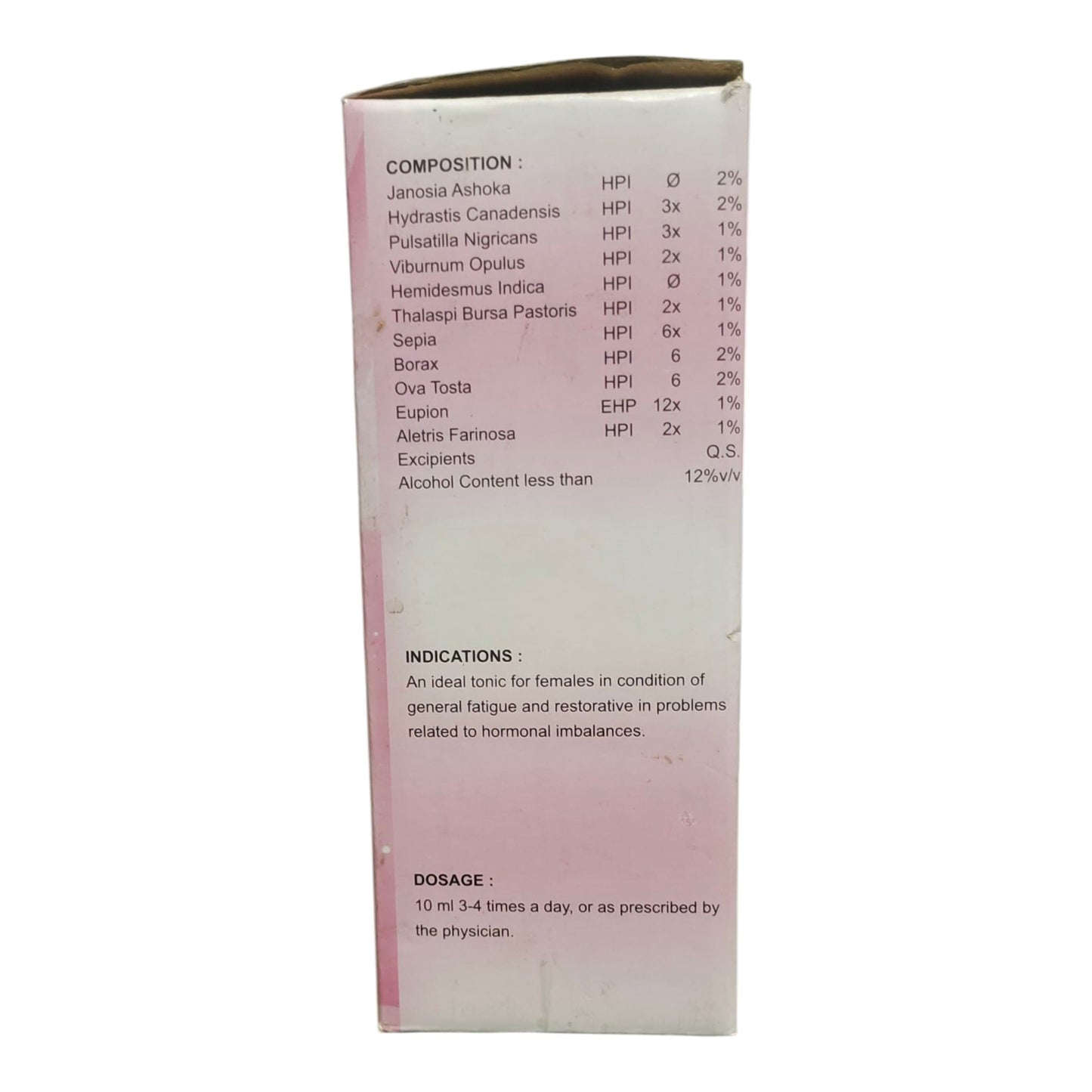 The back of a light pink and white cardboard box showing product details in English, including composition ingredients, indications, and dosage, photographed against a plain white background.