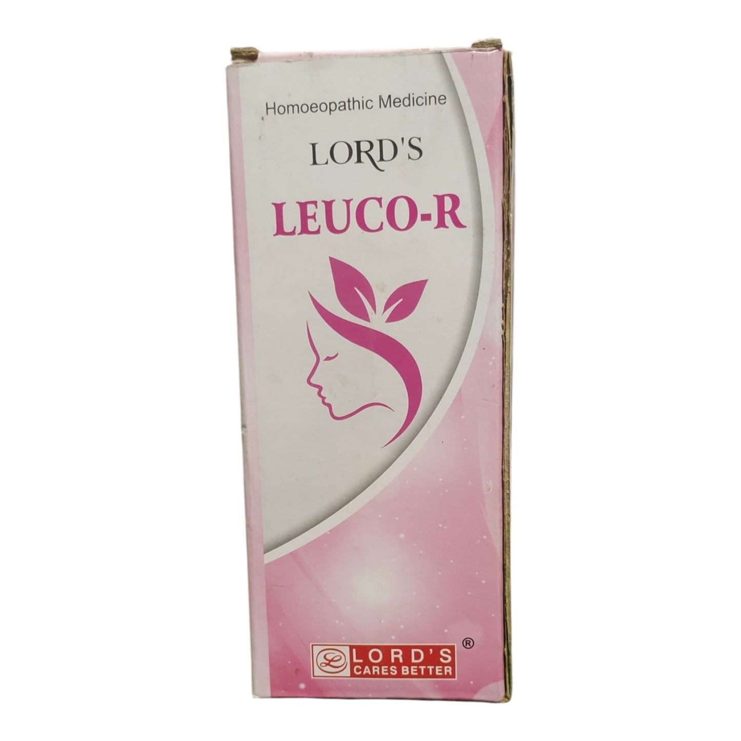 A boxed homeopathic medicine product named LORD'S LEUCO-R, shown upright against a plain white background. The box is primarily white and pink with a stylized pink female silhouette and leaf graphic, plus the brand text 'LORD'S' and 'CARES BETTER' near the bottom.