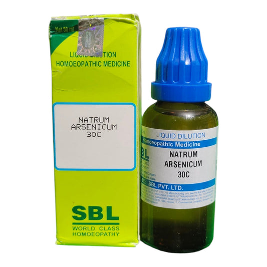 A bottle of SBL Liquid Dilution Natrum Arsenicum 30C homeopathic medicine next to its lime green box packaging, set against a plain white background.