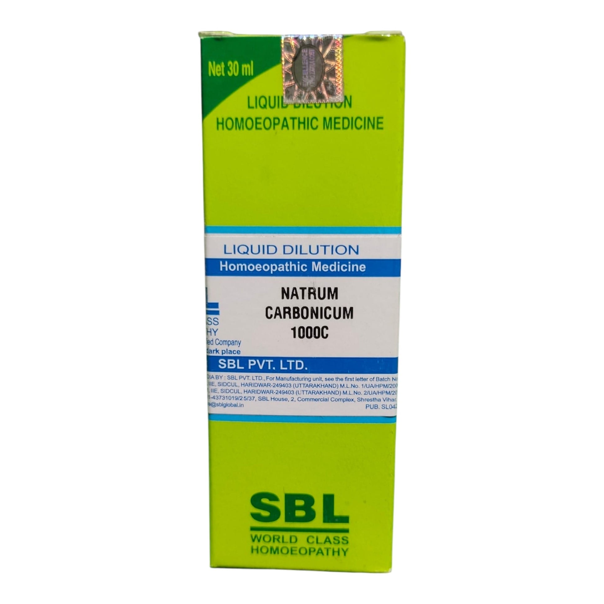 A box of SBL Liquid Dilution Homeopathic Medicine, Natrum Carbonicum 1000C, 30 ml. The packaging is lime green with white and blue text bands and a small illustration of a snail near the top.