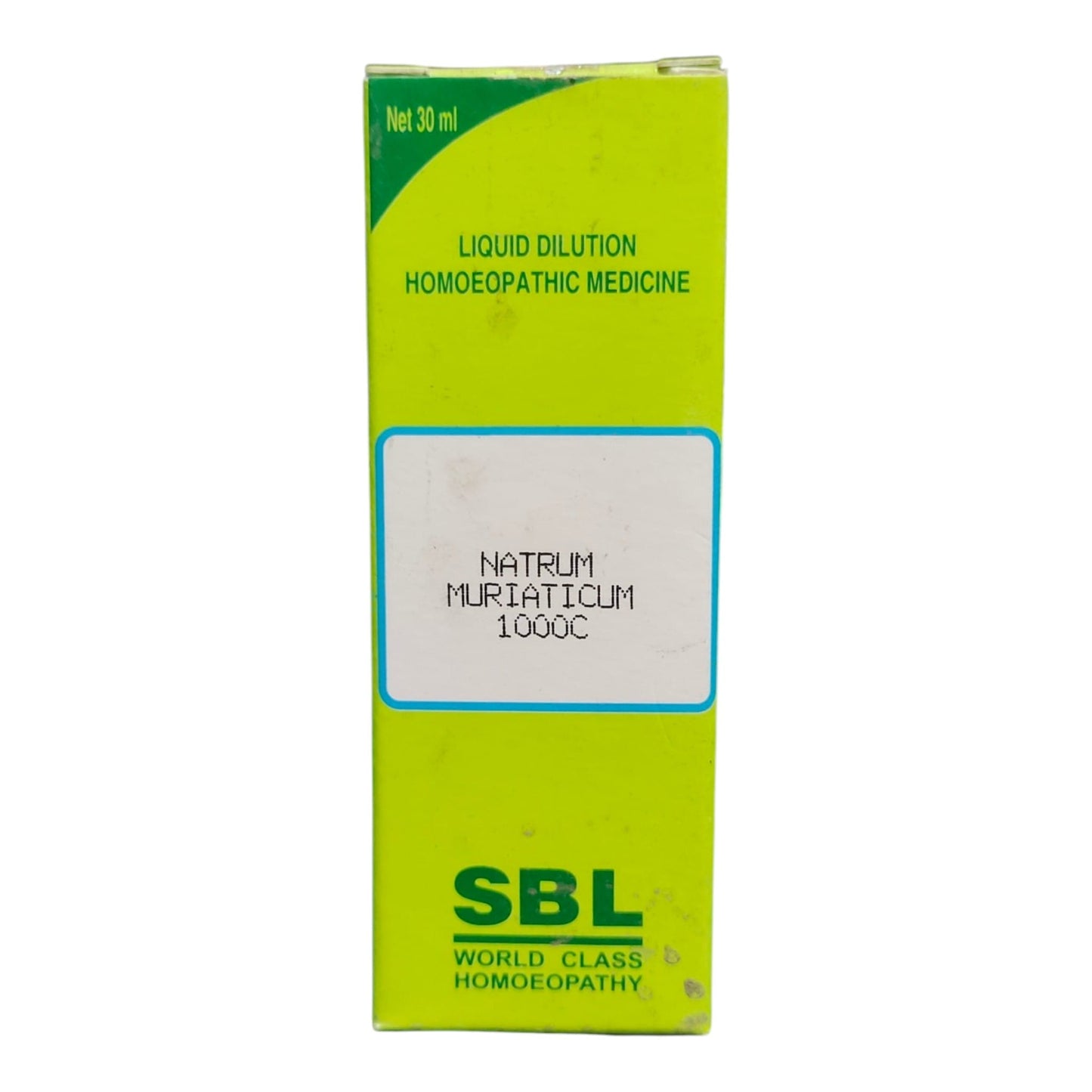 A green rectangular box of SBL Liquid Dilution Homeopathic Medicine, specifically Natrum Muriaticum 1000C, on a plain white background.