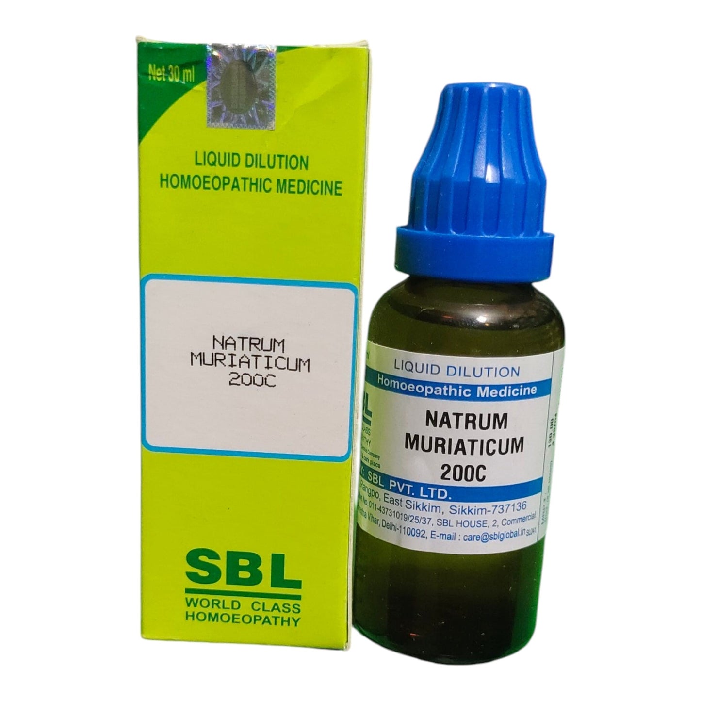 A bottle of SBL Natrum Muriaticum 200C liquid dilution homeopathic medicine next to its lime green and white cardboard packaging box, on a plain white background.