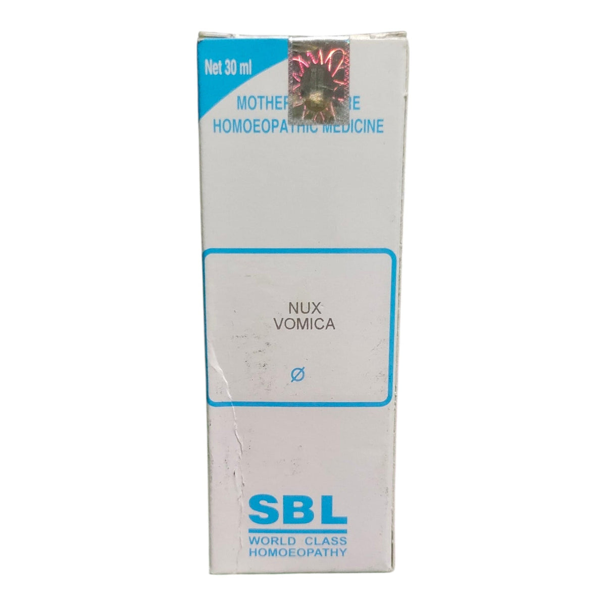 A tall white cardboard box of SBL Nux Vomica homeopathic medicine, featuring blue text and border details on a white background.