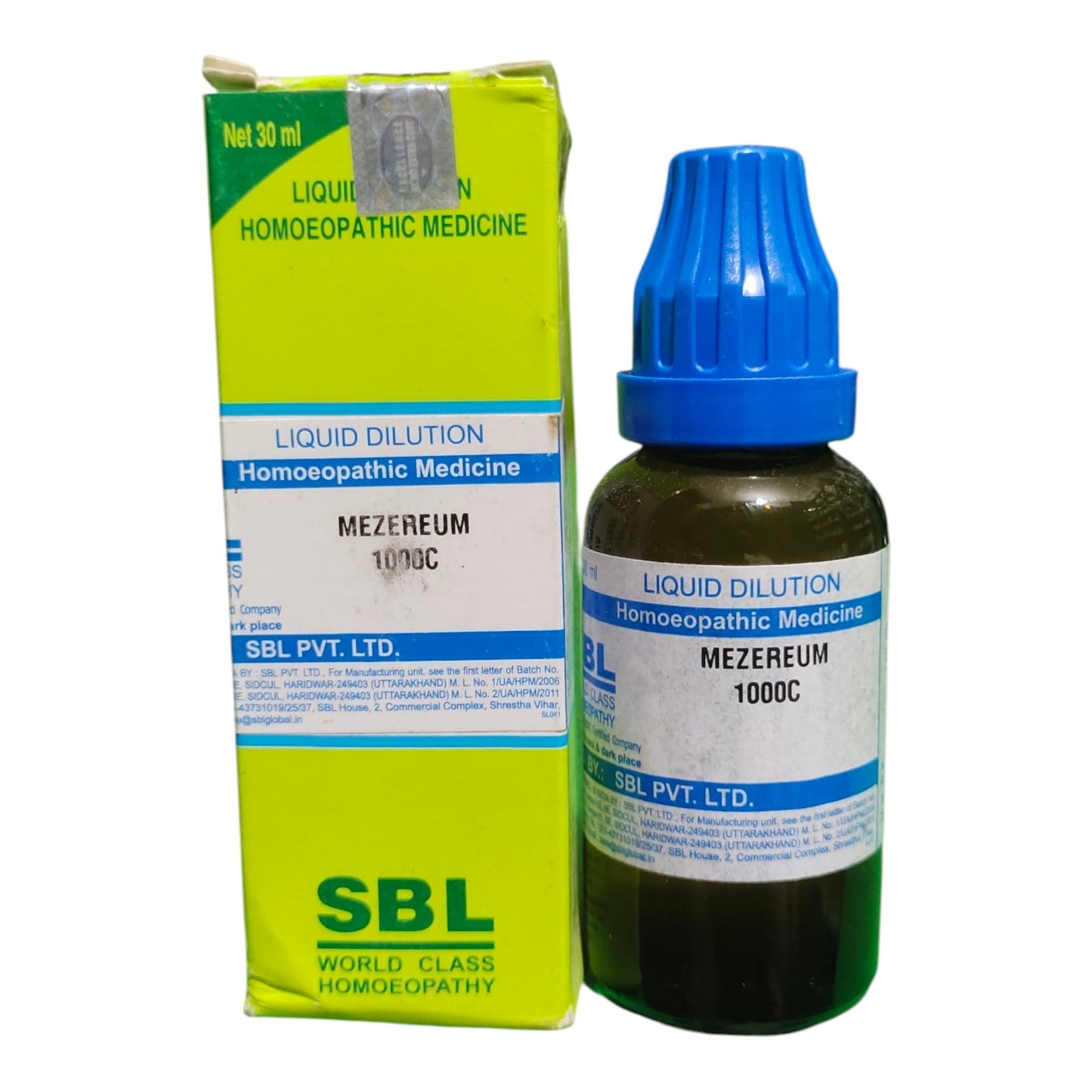 A bottle of SBL Liquid Dilution Homeopathic Medicine (Mezereum 1000C) with a blue cap next to its lime green and white cardboard packaging box on a white background.