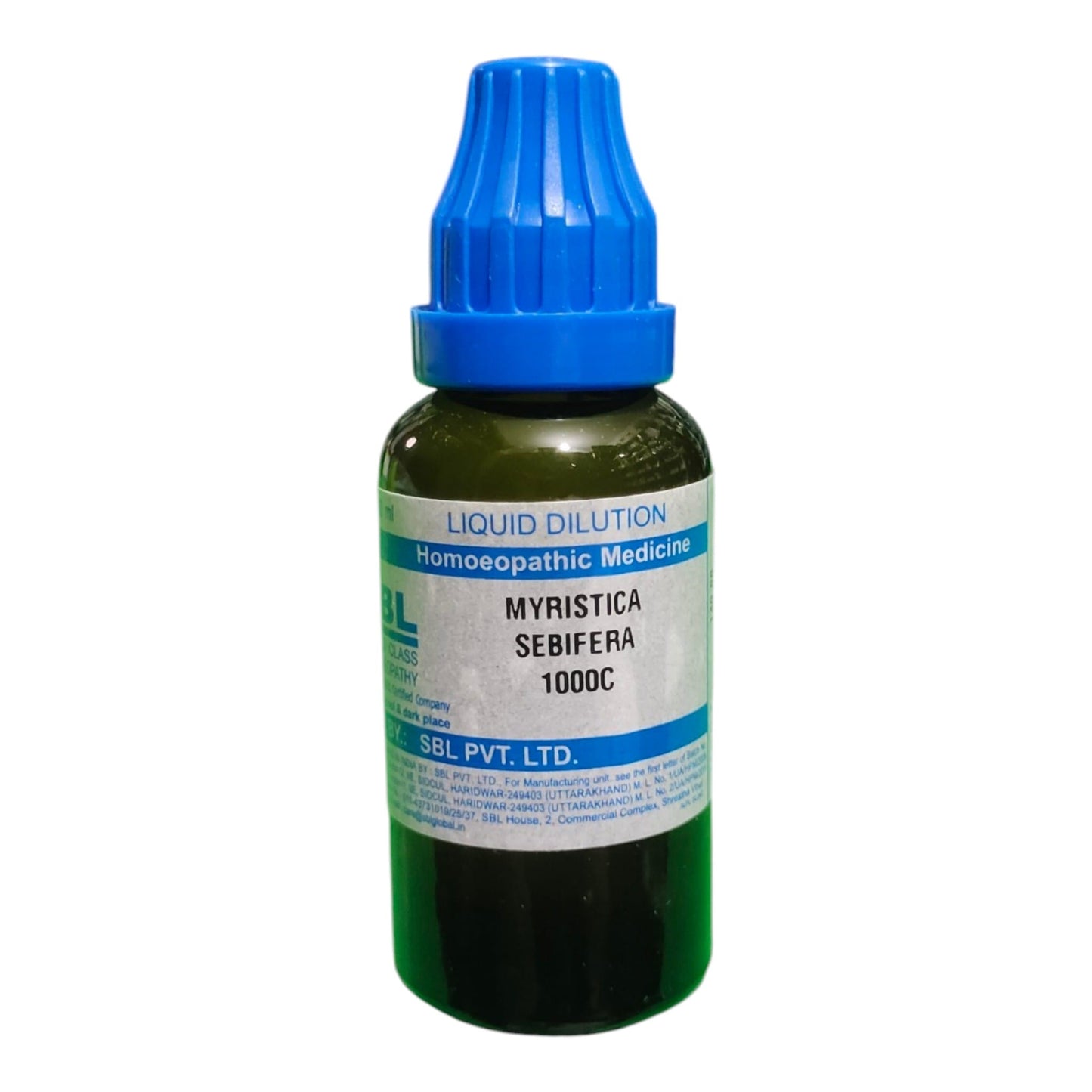 A dark green glass dropper bottle of homeopathic medicine with a blue cap and a white label reading 'MYRISTICA SEBIFERA 1000C' and 'SBL PVT. LTD.