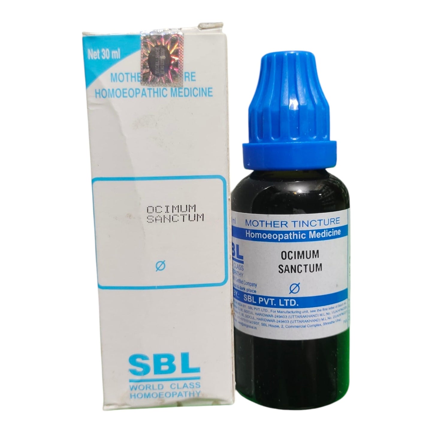 A bottle of SBL Mother Tincture Homoeopathic Medicine next to its white and blue retail box on a plain white background.
