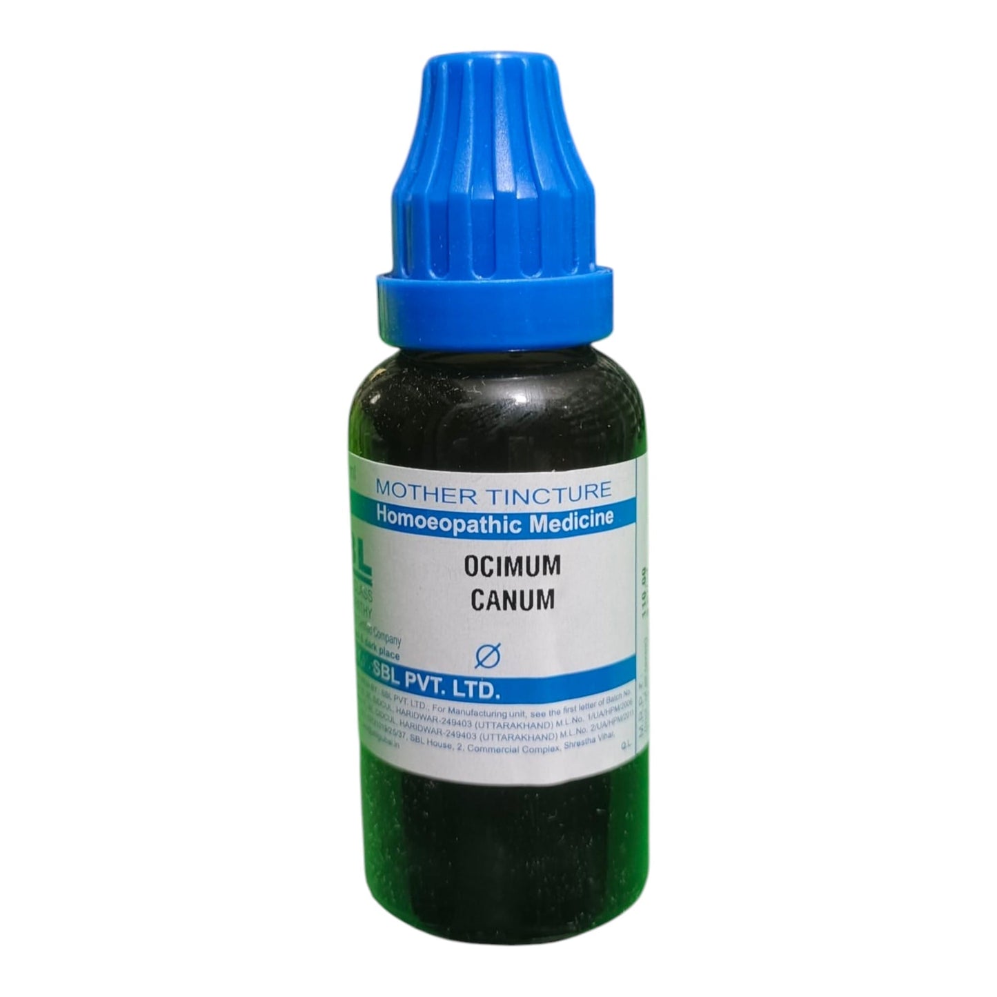 A dark glass bottle of homeopathic medicine with a blue cap and a white label reading 'OCIMUM CANUM' and 'MOTHER TINCTURE'.