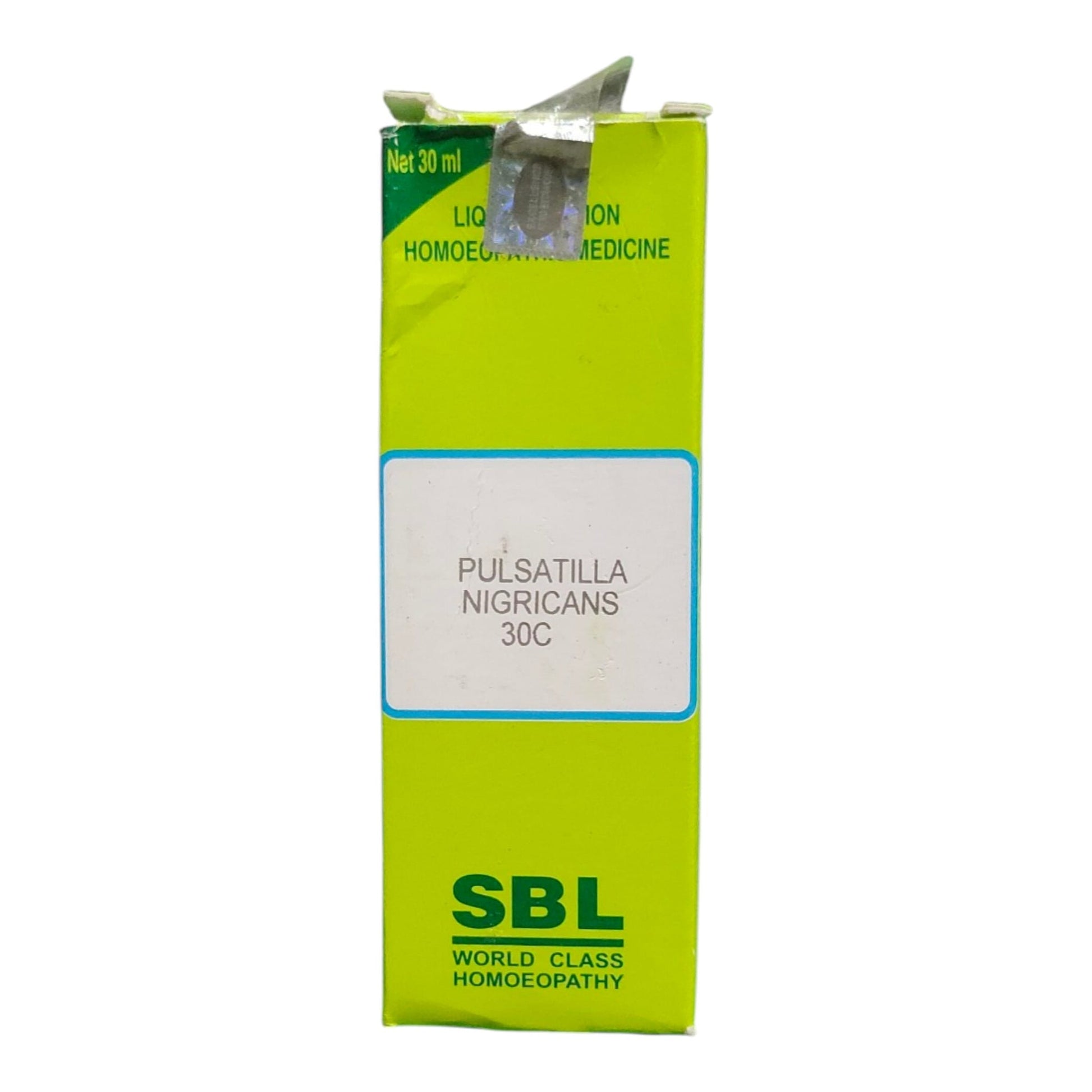A bright lime green cardboard box of SBL Pulsatilla Nigricans 30C homeopathic medicine, featuring a white label in the center and the SBL brand logo at the bottom.