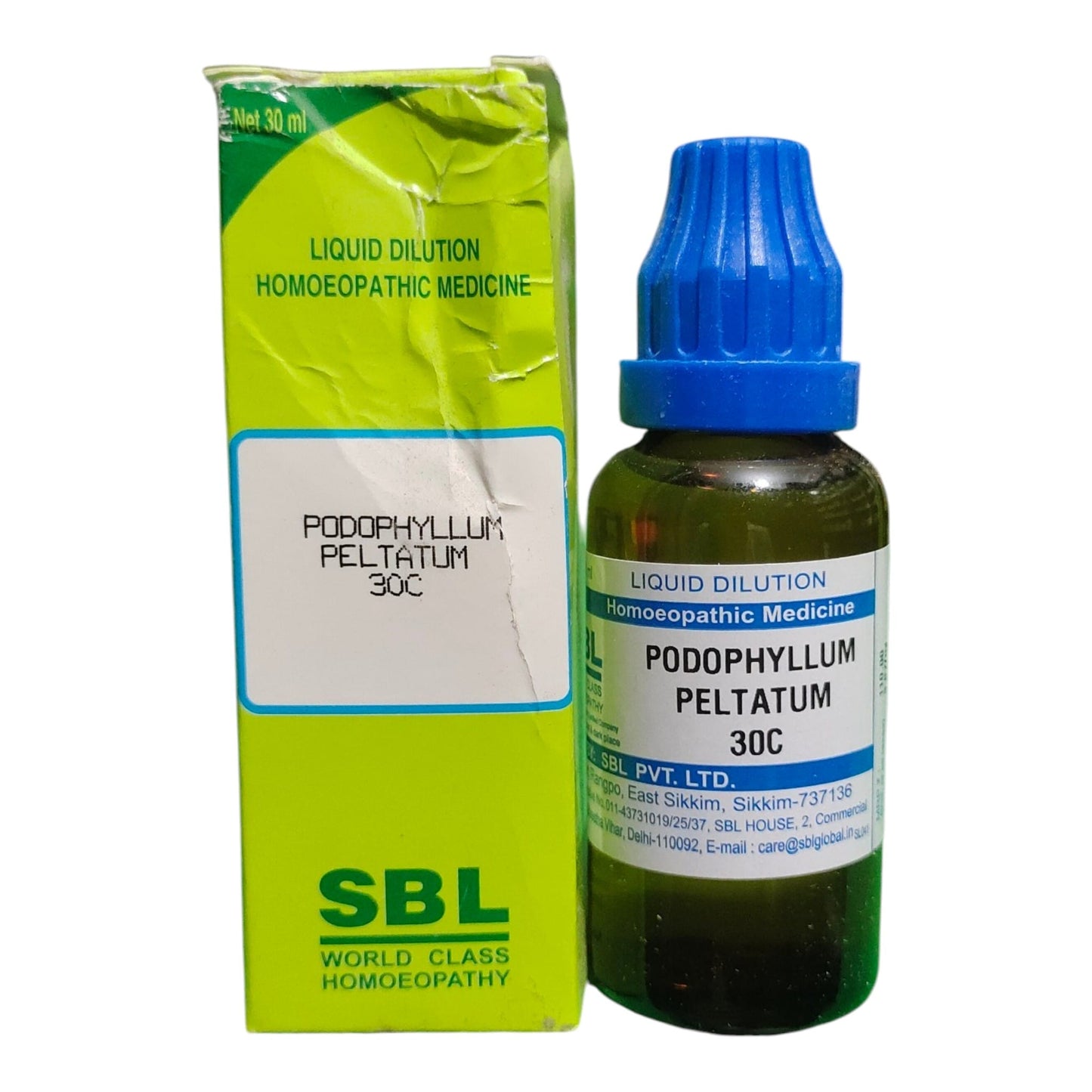 A bottle of SBL World Class Homeopathy Podophyllum Peltatum 30C liquid dilution medicine next to its lime green cardboard box, on a white background.
