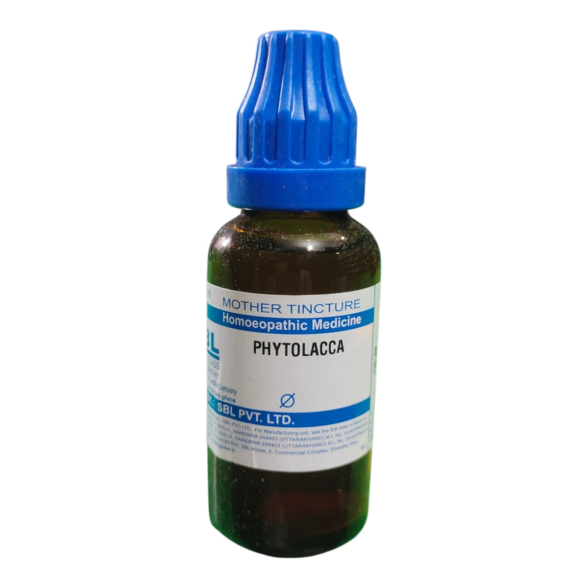 A small amber glass bottle of homeopathic medicine with a blue ribbed cap and a white label reading 'MOTHER TINCTURE Homeopathic Medicine PHYTOLACCA' and 'JBL PVT. LTD.