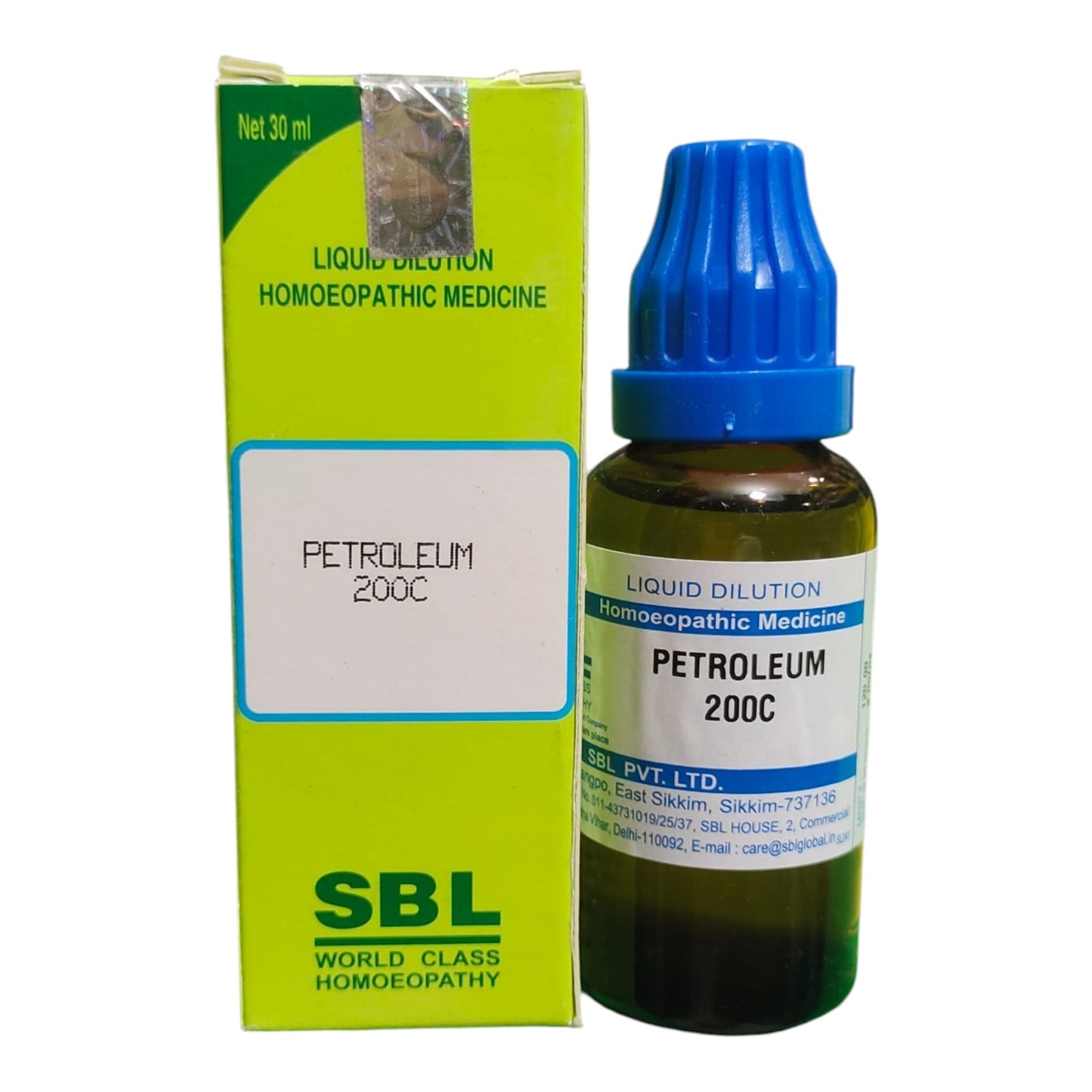 A bottle of SBL Petroleum 200C homeopathic medicine next to its lime green and white packaging box, on a plain white background.