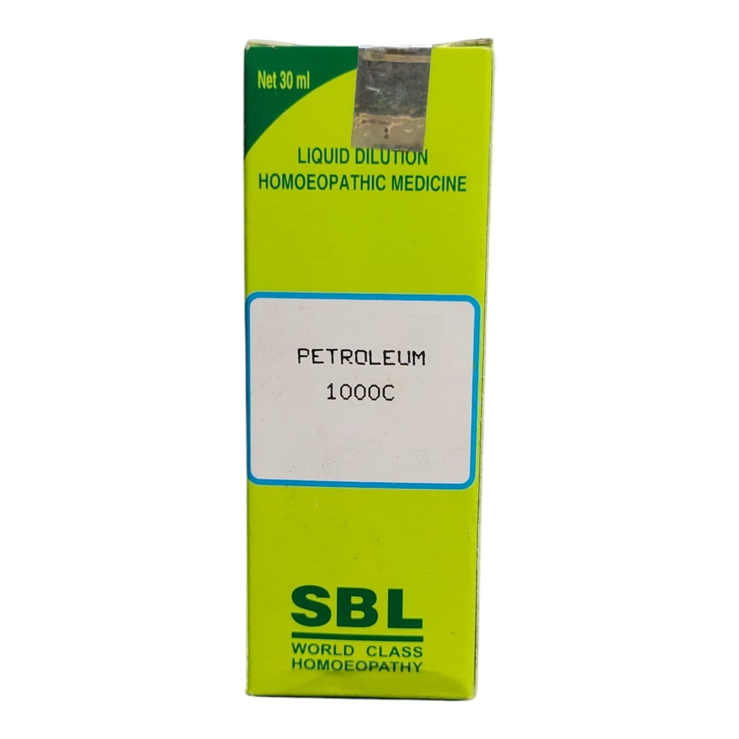 A 30 ml box of SBL Petroleum 1000C liquid dilution homeopathic medicine, featuring a bright lime green and yellow-green design with a white label in the center.