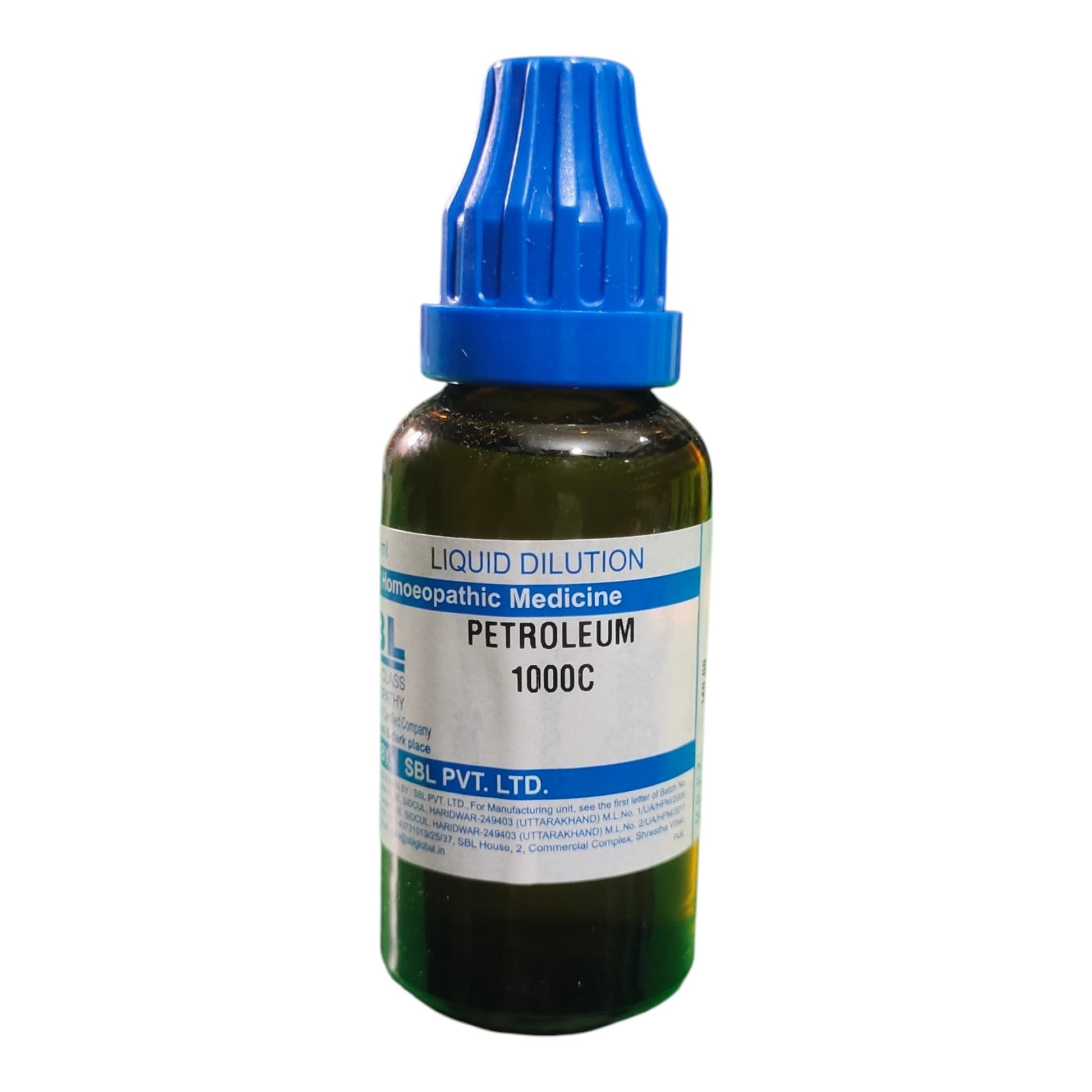 A dark amber glass bottle of petroleum 1000C liquid dilution medicine with a blue dropper cap and a white label, shown on a plain white background.