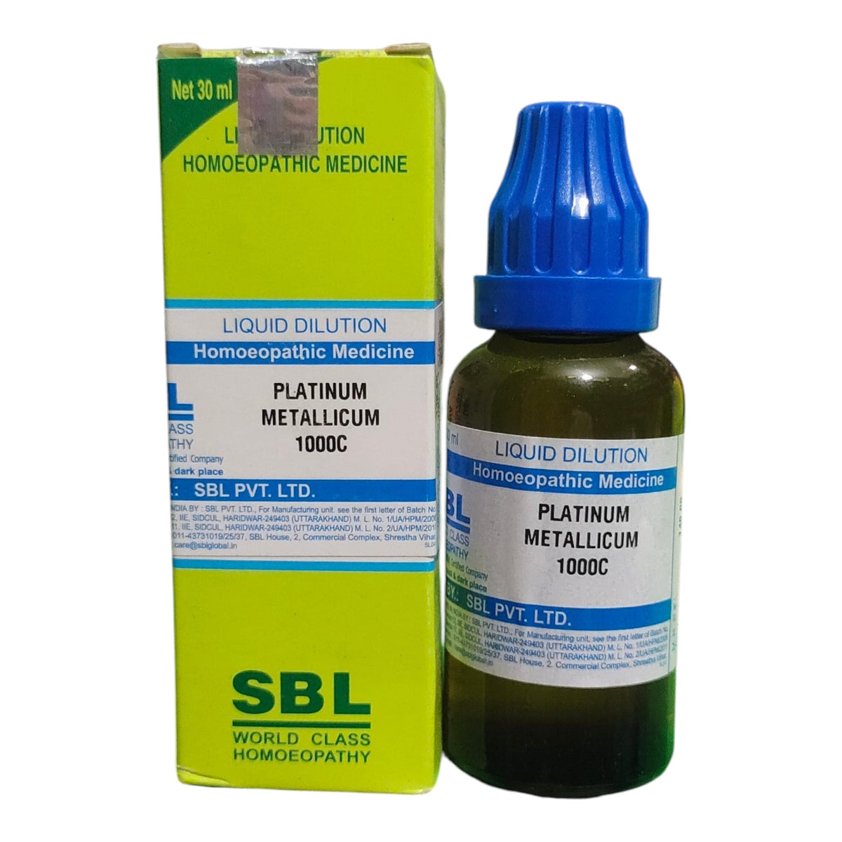 A bottle of SBL Platinum Metallicum 1000C homeopathic liquid medicine with a blue dropper cap next to its lime green and white cardboard packaging box.